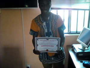 Akin displaying his Certificate after SPSS Training